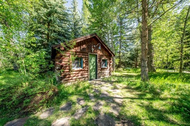 Set on 2.5 acres directly on the Bigwood River within a private - photo 33