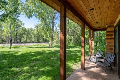 Set on 2.5 acres directly on the Bigwood River within a private - photo 41