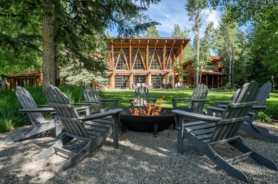Set on 2.5 acres directly on the Bigwood River within a private - photo 42