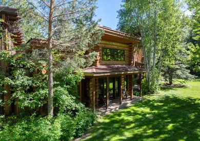 Set on 2.5 acres directly on the Bigwood River within a private - photo 45