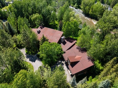 Set on 2.5 acres directly on the Bigwood River within a private - photo 49