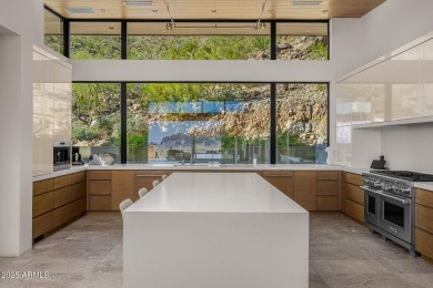 Positioned on a serene hillside Paradise Reserve, this modern