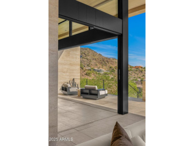 Positioned on a serene hillside Paradise Reserve, this modern