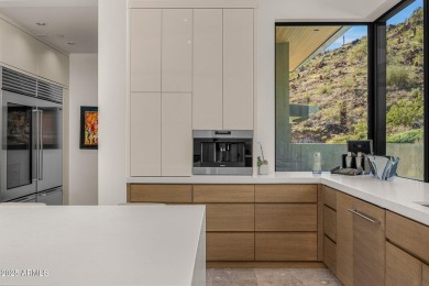 Positioned on a serene hillside Paradise Reserve, this modern