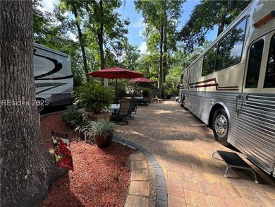 This gorgeous RV lot has a paver pad with a hardscape wall and - photo 6