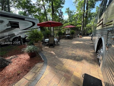 This gorgeous RV lot has a paver pad with a hardscape wall and - photo 7