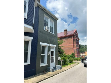 Characteristic Row House with shaded side lawn and off street - photo 1