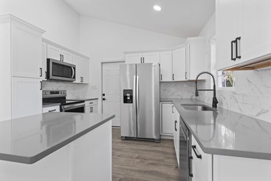 Price Improvement! Beautifully updated 3BR/2BA pond-front home - photo 11