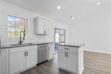 Price Improvement! Beautifully updated 3BR/2BA pond-front home - photo 12