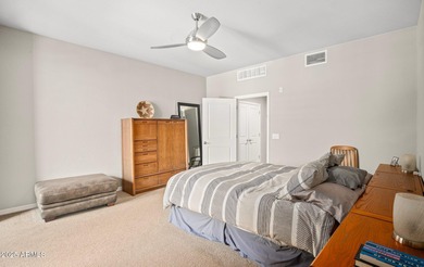 This highly upgraded North Scottsdale gated condominium offers