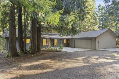Tucked away on nearly 7 acres of serene, forested privacy, this - photo 2