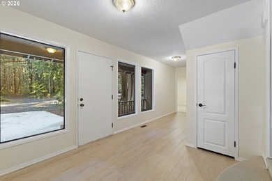 Tucked away on nearly 7 acres of serene, forested privacy, this - photo 3