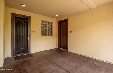 This highly upgraded North Scottsdale gated condominium offers