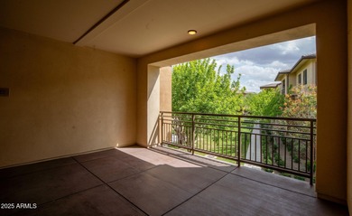 This highly upgraded North Scottsdale gated condominium offers
