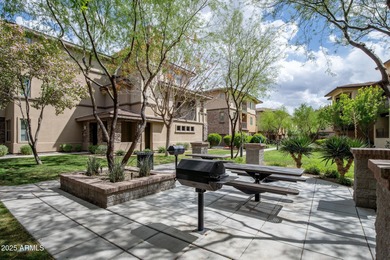 This highly upgraded North Scottsdale gated condominium offers