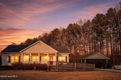 This beautiful home and the lot right beside it are nestled on a