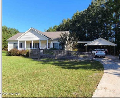 This beautiful home and the lot right beside it are nestled on a