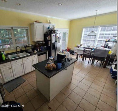 This beautiful home and the lot right beside it are nestled on a