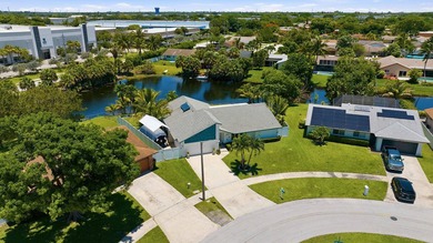 This well-maintained 3-bed, 2-bath CBS pool home sits on one of - photo 4