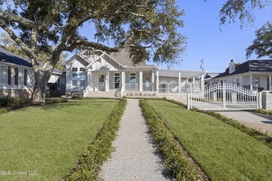Stunning beachfront bungalow located on a prime corner lot with - photo 1