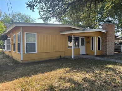 This charming home features a carport and a fenced backyard - photo 2