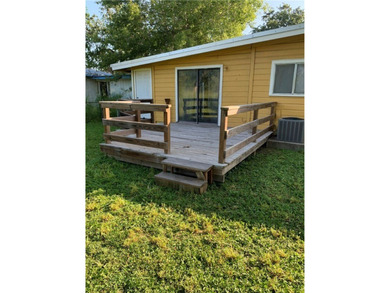 This charming home features a carport and a fenced backyard - photo 4