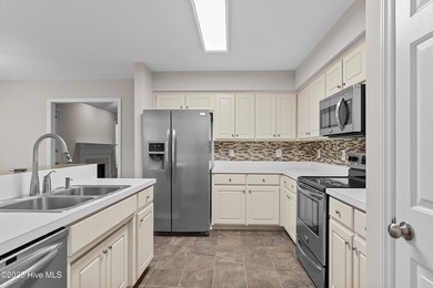 Welcome to 1205 Woodburn Ct, a well-maintained 3 bedroom, 2 bath