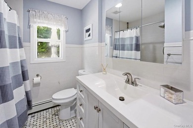 Refined comfort meets effortless Long Island living in this - photo 12