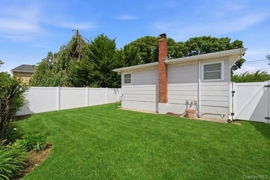 Refined comfort meets effortless Long Island living in this - photo 16