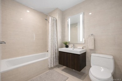 Welcome to Grand One at Sky View Parc. This mint one-bedroom