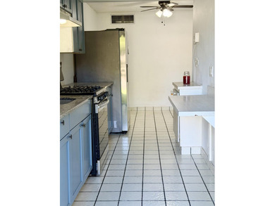 ComWelcome home to this beautifully maintained first-floor - photo 2