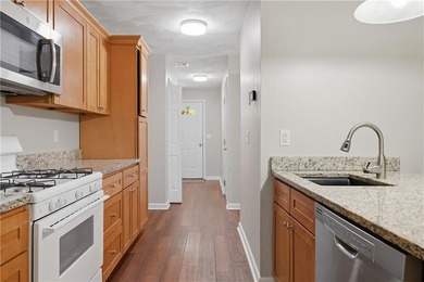 Welcome to this well-maintained 2-bedroom, 1.5-bath condominium - photo 11