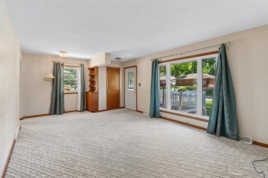 Welcome to this all-brick ranch home! The bright sunny living - photo 3
