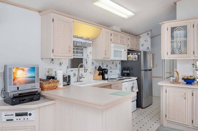 This spacious 1/1 Park Model located in The Waves RV Resort - a - photo 2
