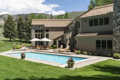 Set on 6.7 pristine acres along the Big Wood River and bordering - photo 12