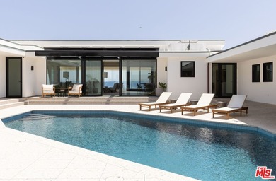 This completely reimagined, exceptional oceanfront estate offers - photo 1