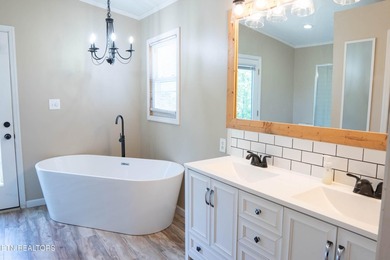 Half an acre. A creek. A master bath that belongs in a magazine - photo 2
