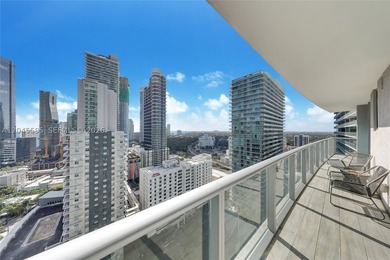 High above the urban core, this exclusive corner residence - photo 1