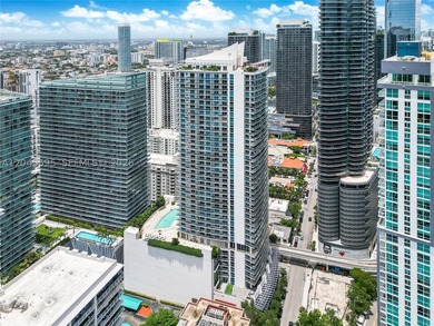 High above the urban core, this exclusive corner residence - photo 3