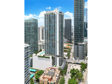 High above the urban core, this exclusive corner residence - photo 5