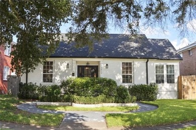 Thoughtfully renovated in 2021, this Canal Blvd residence blends - photo 2