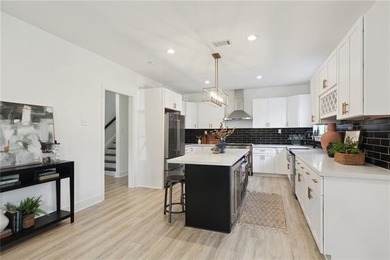 Thoughtfully renovated in 2021, this Canal Blvd residence blends - photo 9