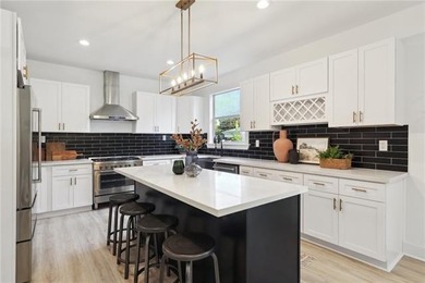 Thoughtfully renovated in 2021, this Canal Blvd residence blends - photo 10