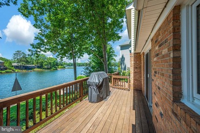 Nestled in a peaceful cove with stunning main lake views and - photo 12