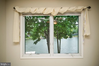 Nestled in a peaceful cove with stunning main lake views and - photo 33
