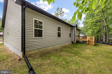 Nestled in the serene Lake of the Woods community, this stunning - photo 40