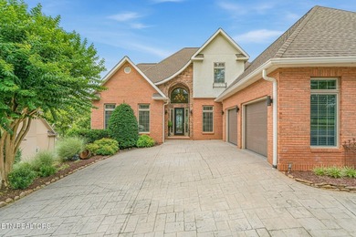 Enjoy peaceful lakefront living in this custom brick and stone - photo 1
