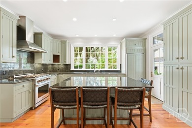 Nestled within the prestigious Ford Field and River Club, this - photo 8