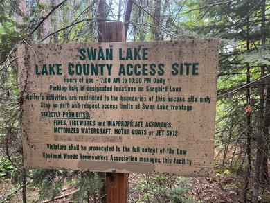 Tucked into a peaceful pocket near Swan Lake, this .67-acre lot - photo 18