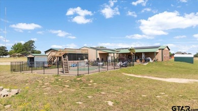 Situated on just over 4 acres in Lindale, this spacious property - photo 40